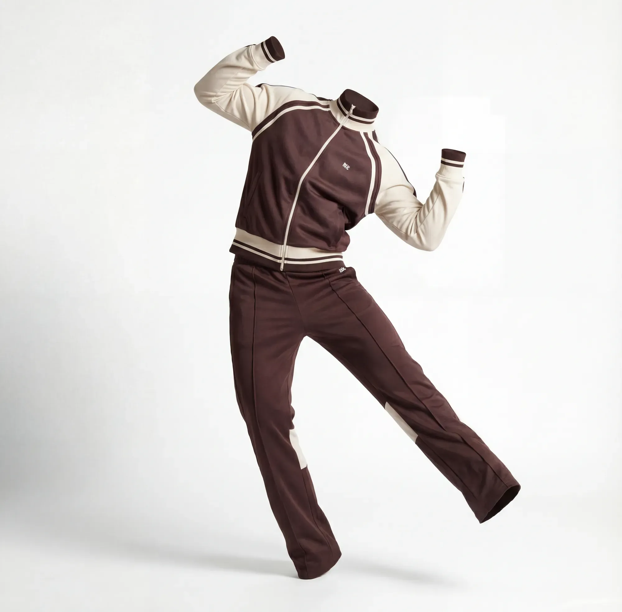 A headless figure in a brown and cream tracksuit, leaning back with one arm raised.